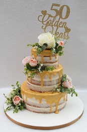 golden wedding anniversary drip cake